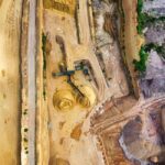 A drone conducting an aerial inspection of a mining site, showcasing advanced technology in action.